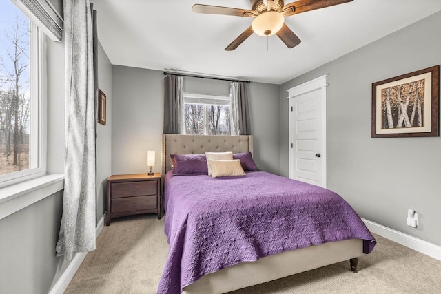 bedroom with carpet floors, baseboards, and a ceiling fan