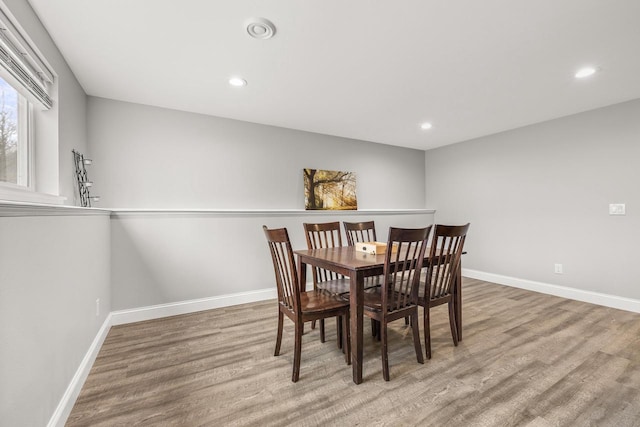 dining room featuring recessed lighting, wood finished floors, and baseboards