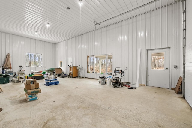 misc room with concrete floors and metal wall