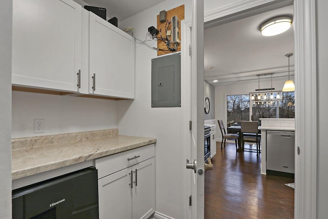 kitchen featuring electric panel, white cabinets, dark wood-style floors, pendant lighting, and stainless steel dishwasher