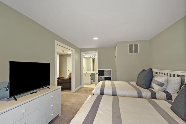 bedroom with light carpet, baseboards, visible vents, ensuite bathroom, and recessed lighting