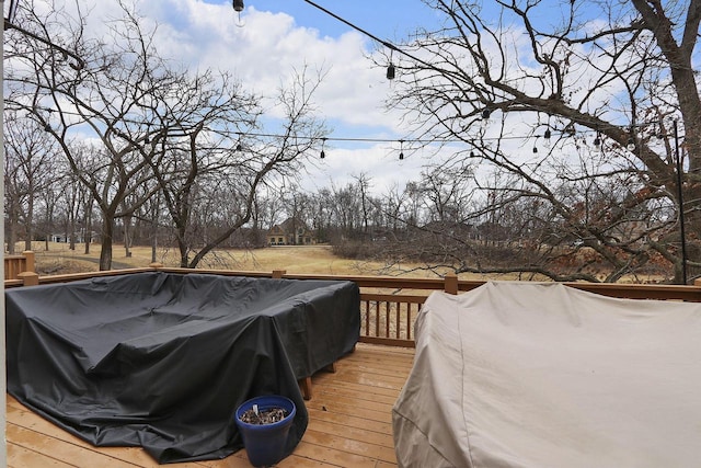 wooden deck with area for grilling