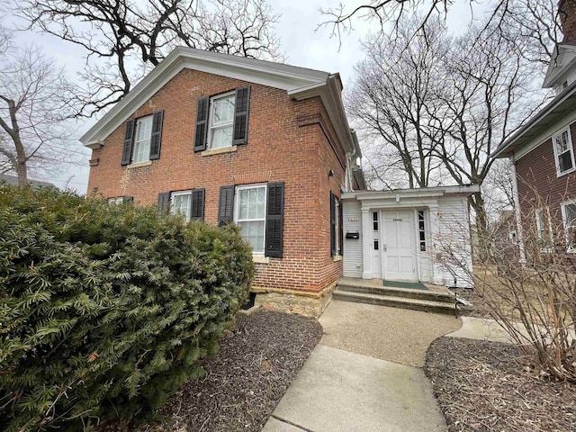 view of front of property featuring brick siding