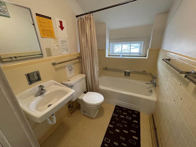 full bathroom featuring toilet, a sink, visible vents, and tile walls