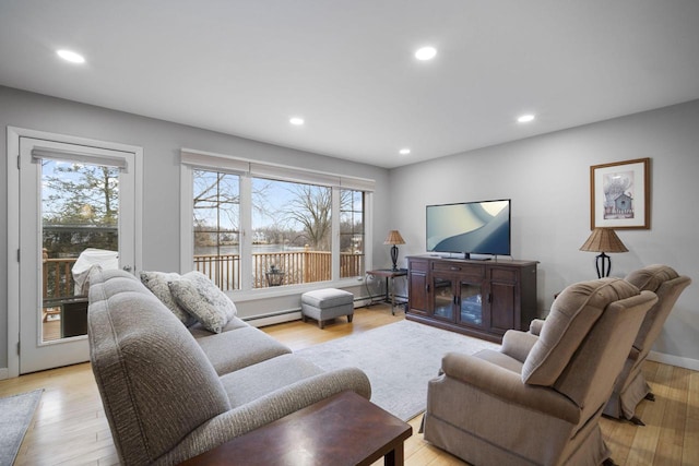 living area featuring light wood-type flooring and plenty of natural light