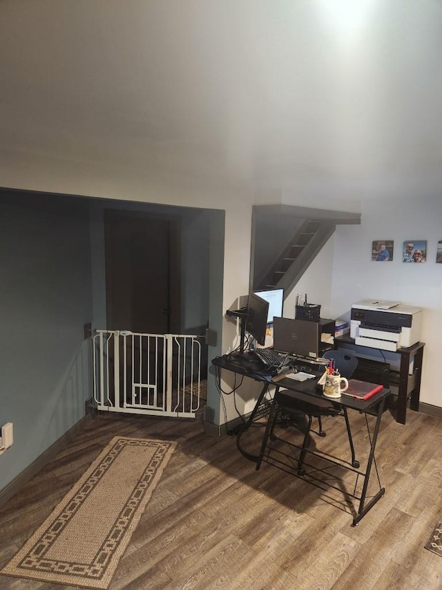 office with wood finished floors and baseboards