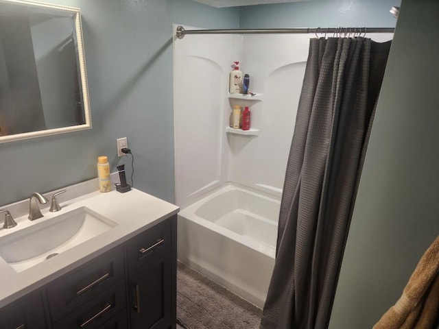 bathroom featuring shower / bath combo with shower curtain and vanity