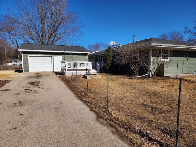 ranch-style house with driveway and an attached garage