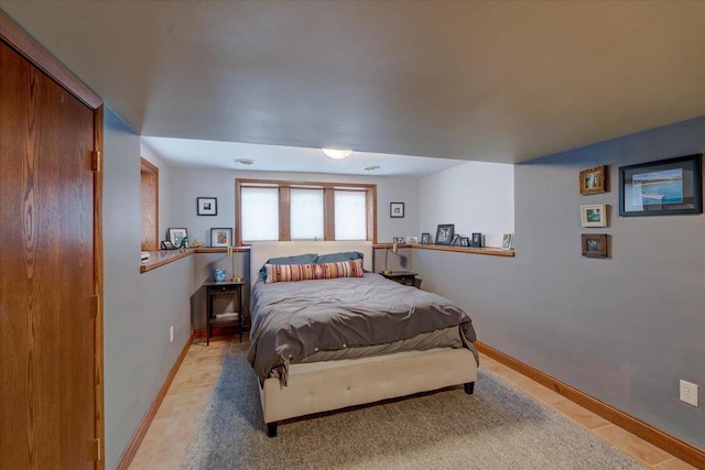 bedroom featuring baseboards