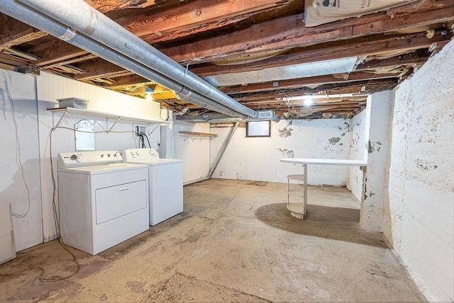 unfinished basement with washer and clothes dryer