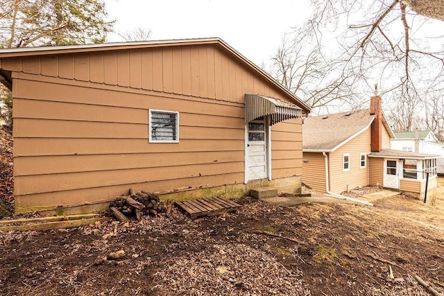 back of house with entry steps