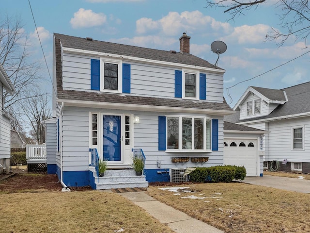 view of front of property with driveway, a shingled roof, a chimney, and a front lawn