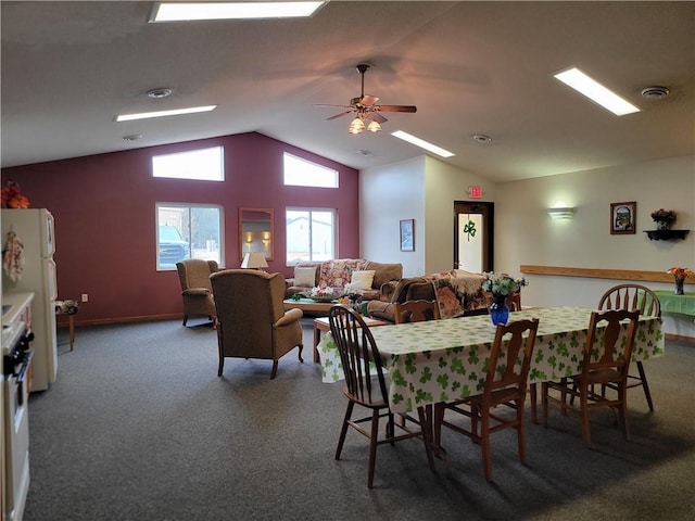 carpeted dining space with lofted ceiling, visible vents, and ceiling fan