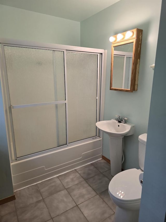 2838 W 3rd Dr, Oxford, WI 53952 - full bathroom with toilet, enclosed tub / shower combo, and tile patterned floors