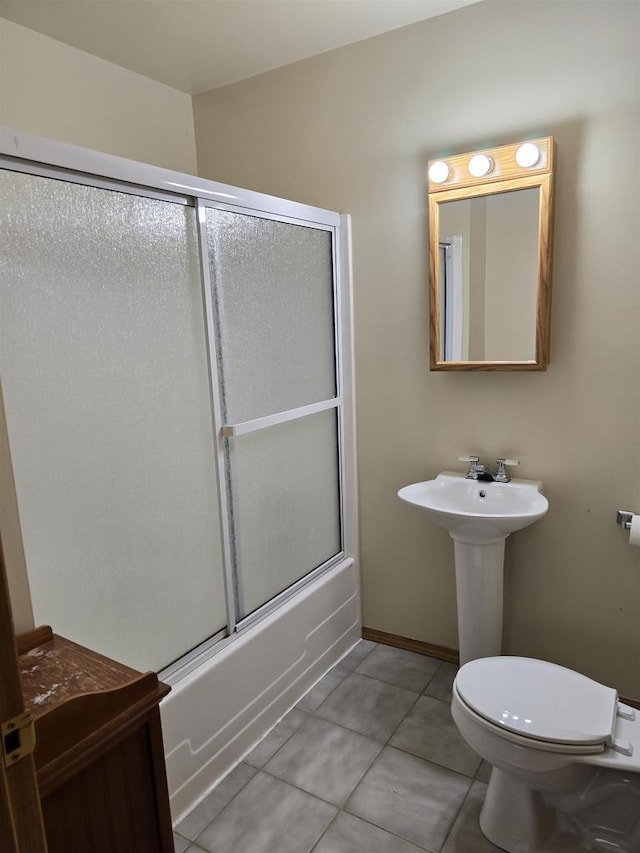 2838 W 3rd Dr, Oxford, WI 53952 - bathroom featuring toilet, enclosed tub / shower combo, and tile patterned floors