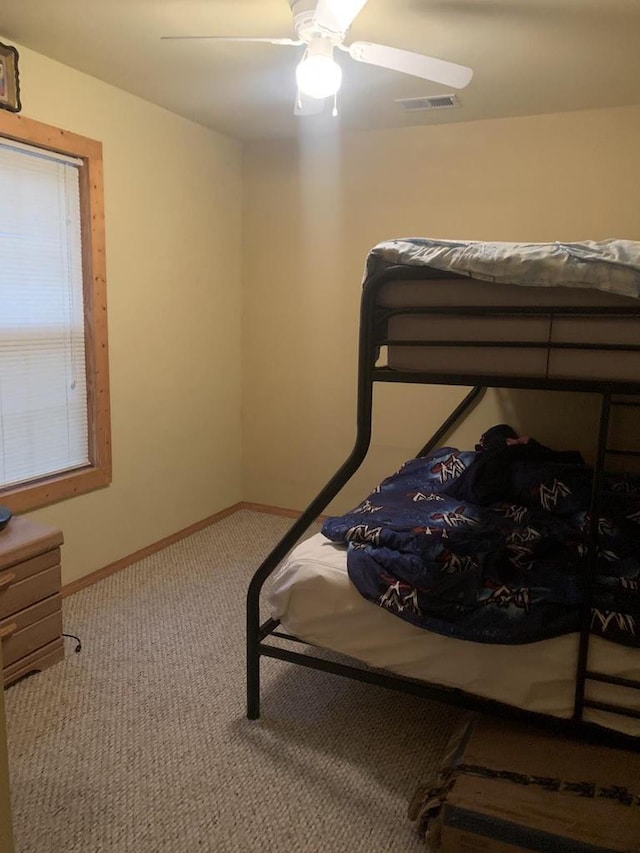 2838 W 3rd Dr, Oxford, WI 53952 - carpeted bedroom with a ceiling fan and baseboards