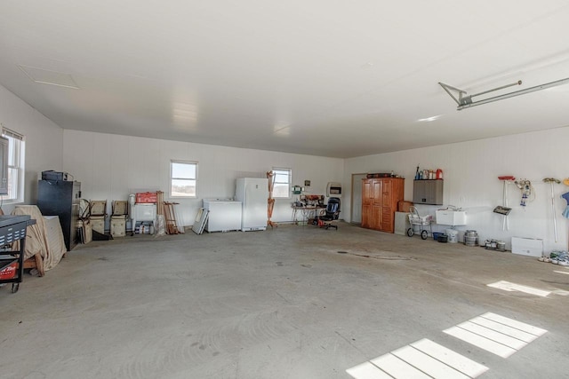 garage with freestanding refrigerator