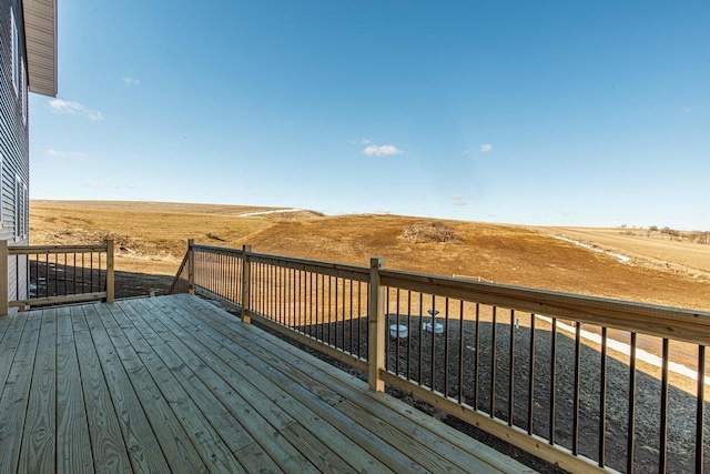 wooden deck featuring a rural view