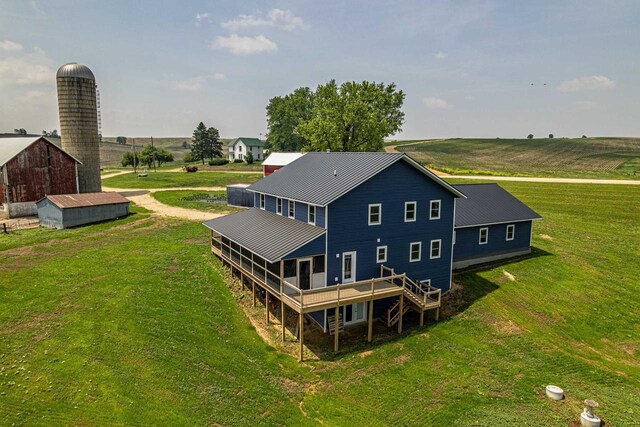 N5184 County Rd N, Monroe, WI 53566 - back of property with a lawn, an outdoor structure, metal roof, and a wooden deck