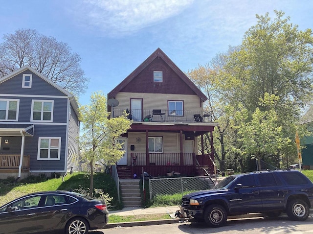 view of front of home with a porch and a balcony