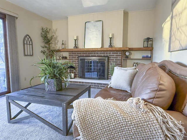 living area with carpet floors and a fireplace