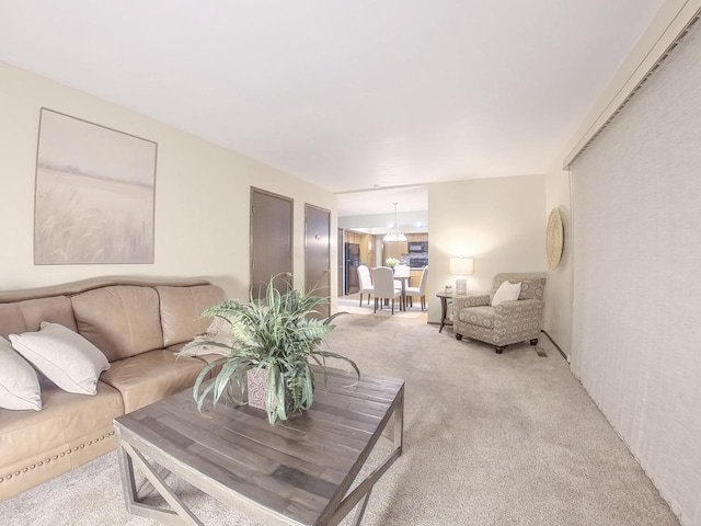 living area with light colored carpet