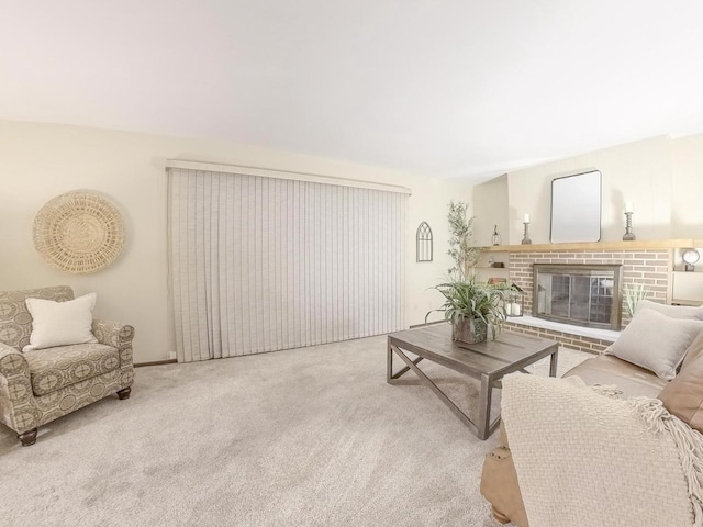 carpeted living area featuring a fireplace