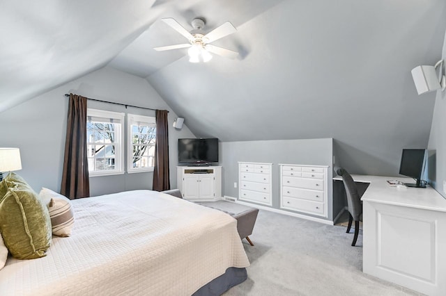 bedroom with light colored carpet, ceiling fan, and vaulted ceiling