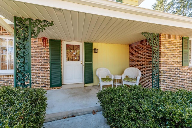 entrance to property with brick siding