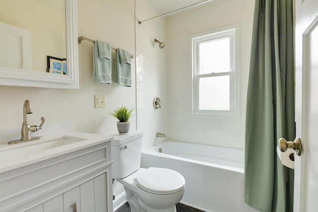 bathroom with shower / bath combo, vanity, and toilet