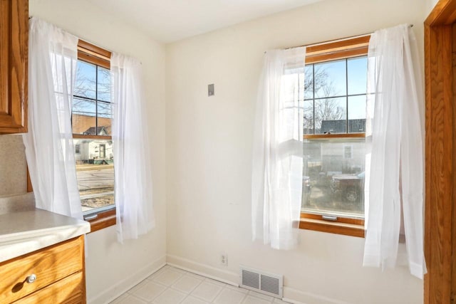 dining space featuring baseboards and visible vents