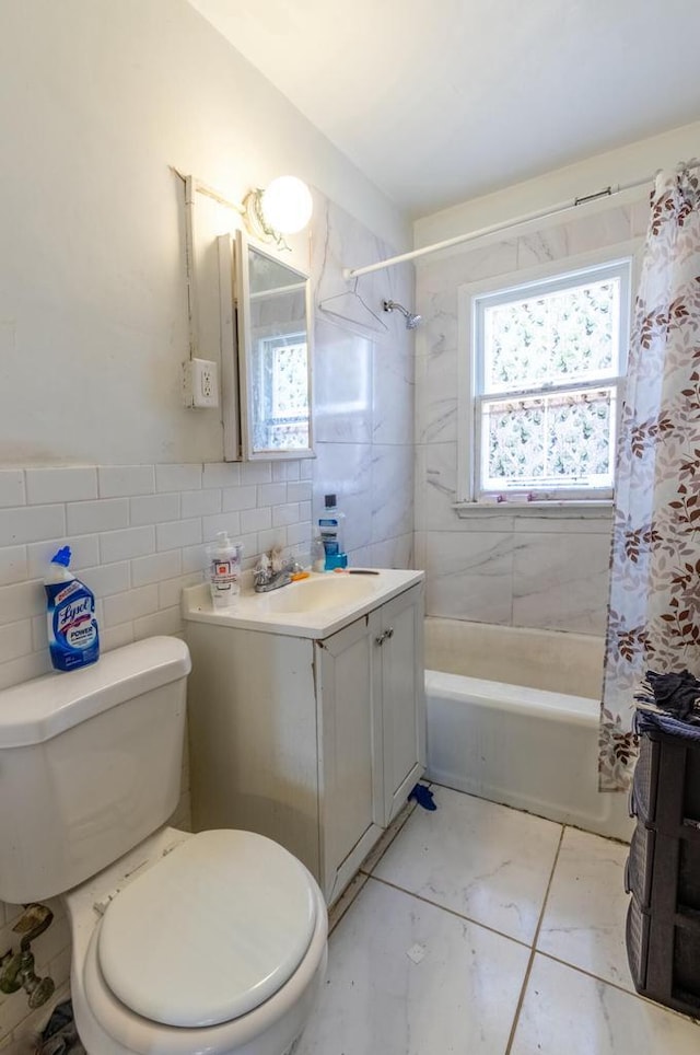 bathroom featuring toilet, shower / bath combination with curtain, tile walls, and vanity