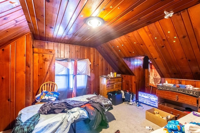 carpeted bedroom with lofted ceiling, wood ceiling, and wooden walls