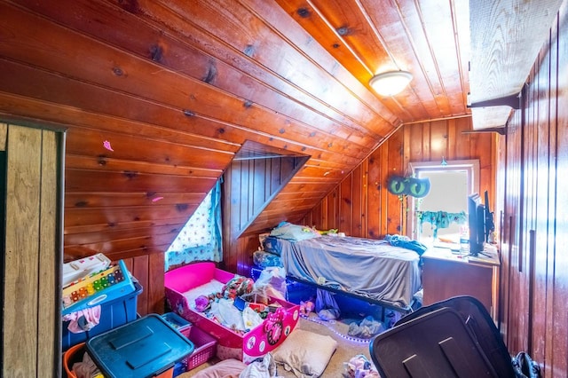 bedroom featuring lofted ceiling, wood ceiling, and wooden walls