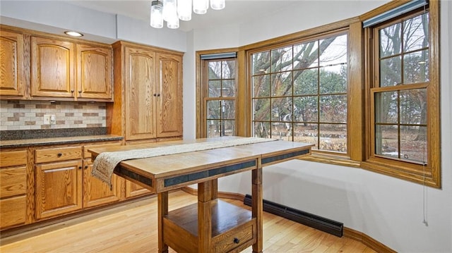 dining space with light wood-style flooring