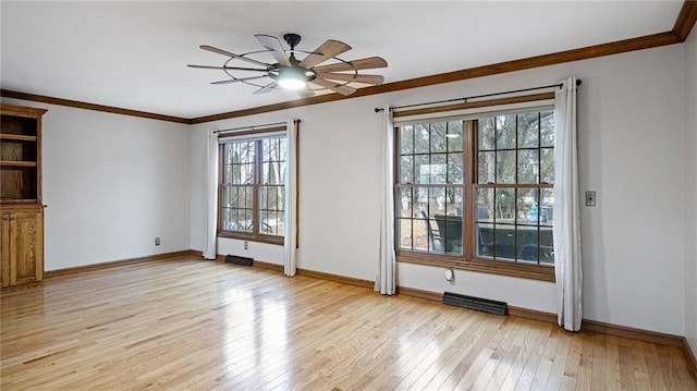 interior space featuring light wood finished floors, baseboards, visible vents, and crown molding