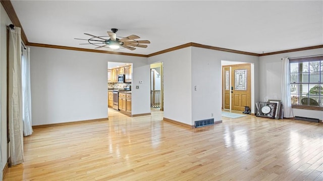 unfurnished living room with a ceiling fan, baseboards, visible vents, light wood-style floors, and crown molding