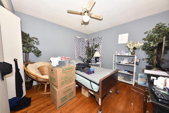 home office with a ceiling fan and wood finished floors