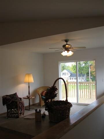 living area featuring ceiling fan