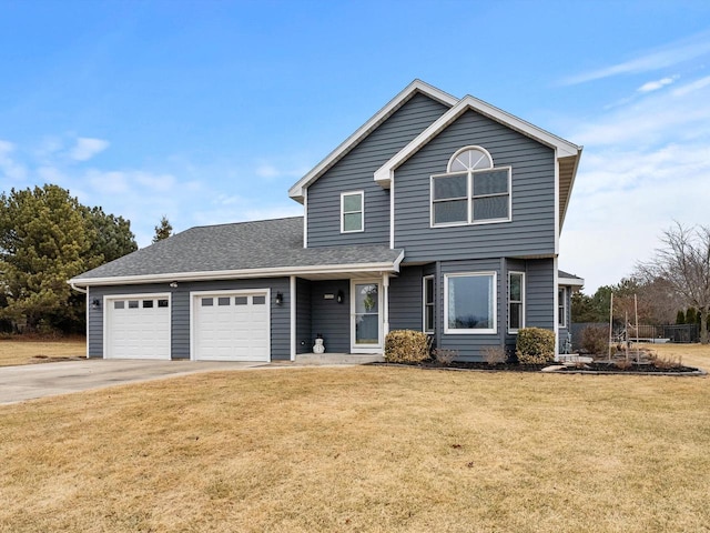 traditional-style home with an attached garage, a shingled roof, concrete driveway, and a front yard