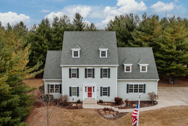 view of front of property featuring roof with shingles