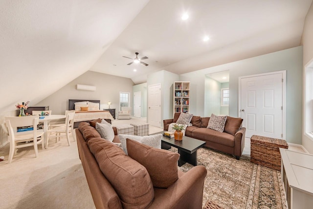 living room featuring vaulted ceiling, a ceiling fan, and light colored carpet