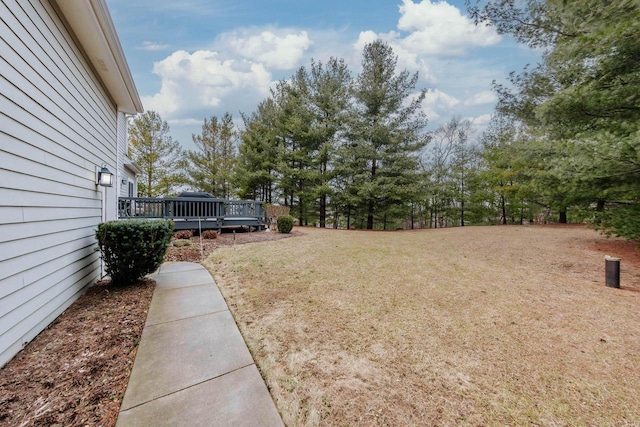 view of yard with a wooden deck