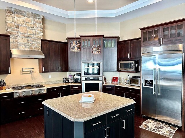 1747 E Drinkman Ln, Eau Claire, WI 54701 - kitchen with stainless steel appliances, glass insert cabinets, wall chimney exhaust hood, and a kitchen island