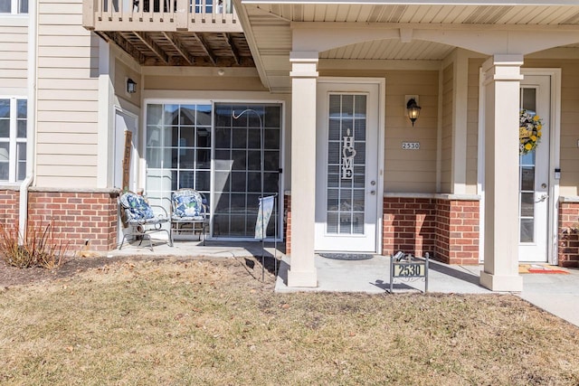 entrance to property with brick siding