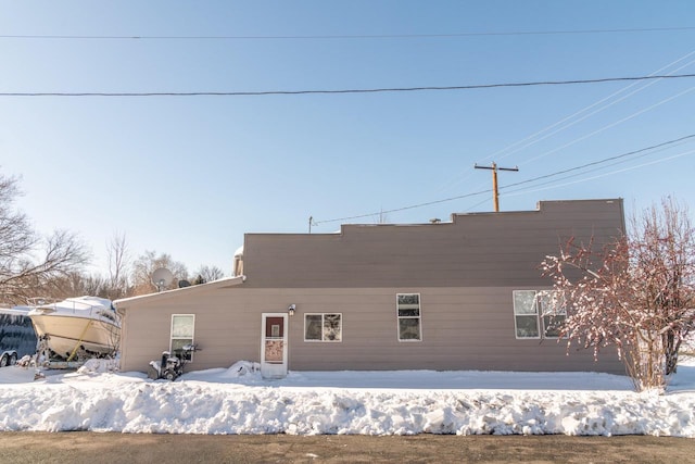 view of snow covered house