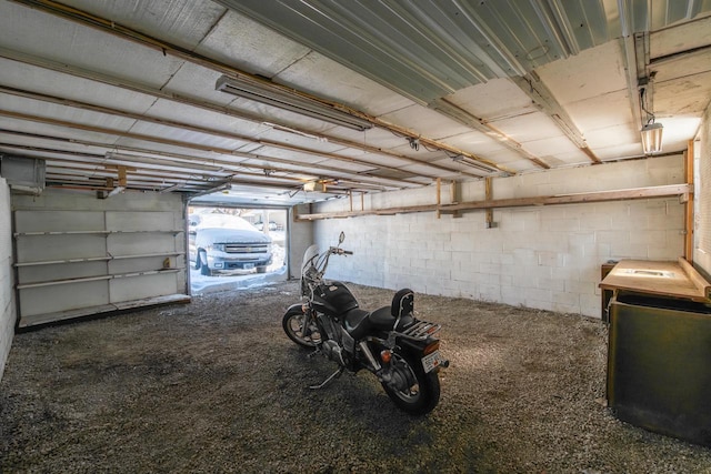 garage with concrete block wall