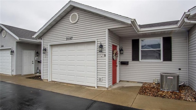 ranch-style home featuring central AC unit