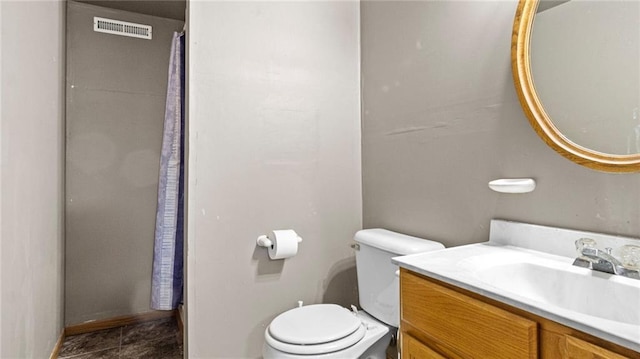 full bathroom with toilet, vanity, and visible vents