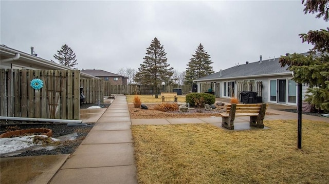 view of yard featuring a patio and fence